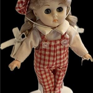 vintage Vogue Ginny girl 

approximately 7.5 inches tall, made of vinyl
